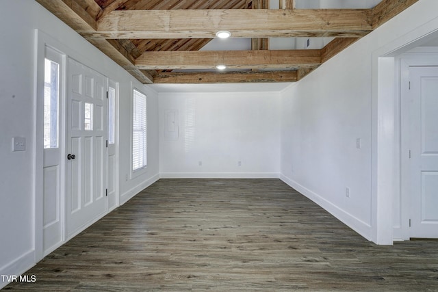 entryway with dark wood-style floors, beam ceiling, and baseboards