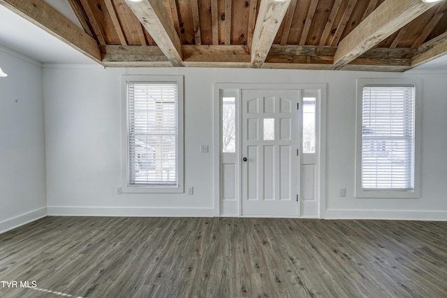 foyer with wooden ceiling, baseboards, wood finished floors, and beamed ceiling