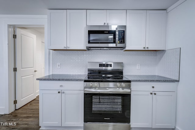 kitchen featuring stainless steel appliances and white cabinetry