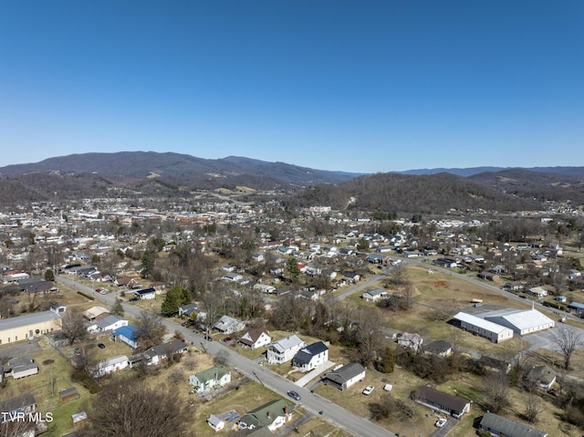 drone / aerial view featuring a residential view and a mountain view