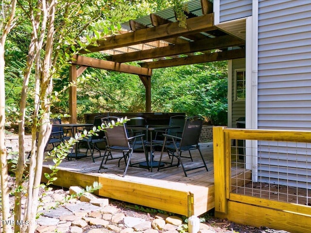 wooden deck with outdoor dining area and a pergola