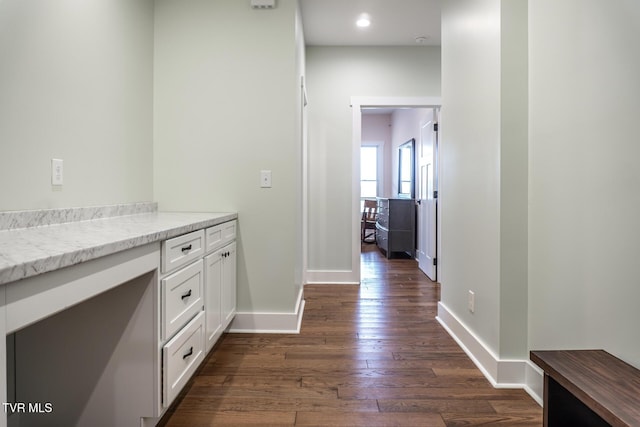 interior space featuring dark wood finished floors, recessed lighting, light countertops, white cabinets, and baseboards