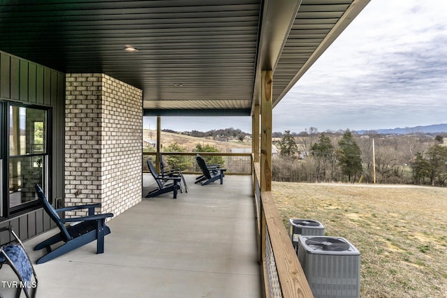 view of patio / terrace with covered porch and cooling unit