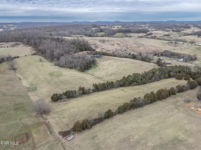 birds eye view of property with a rural view