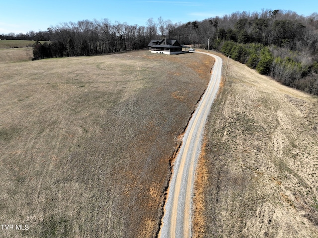 birds eye view of property featuring a rural view