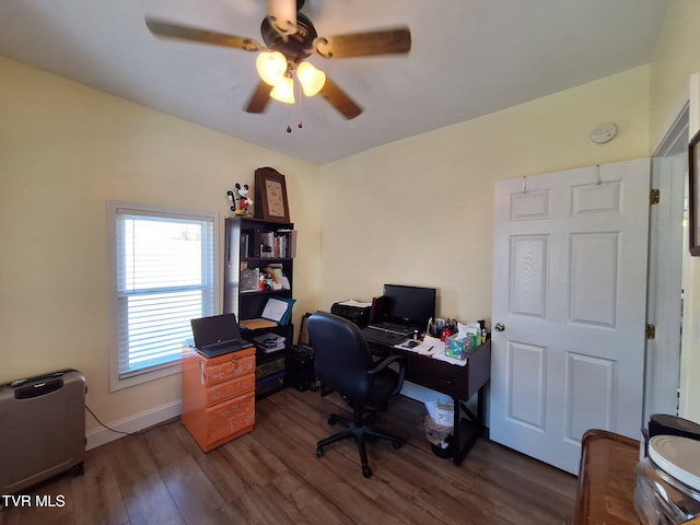 office featuring wood finished floors, a ceiling fan, and baseboards