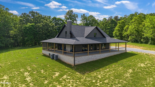 2150 Sunnyside Rd, Greeneville, TN 37743 - view of front of property featuring driveway, a front lawn, a chimney, roof with shingles, and a view of trees