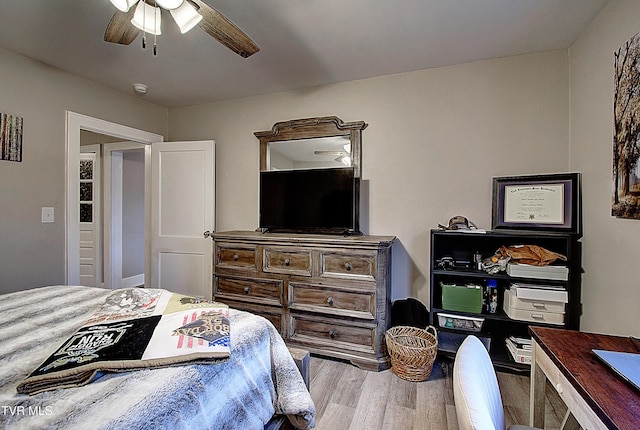 bedroom featuring ceiling fan and wood finished floors