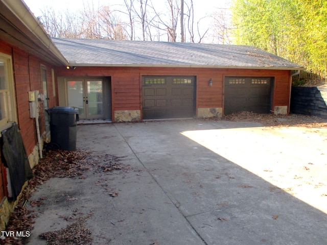 garage with concrete driveway