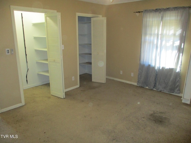 unfurnished bedroom featuring baseboards