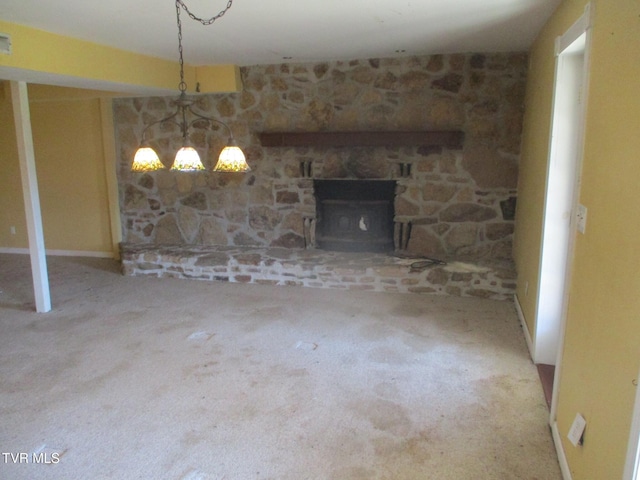 unfurnished living room with carpet floors, a fireplace, and visible vents