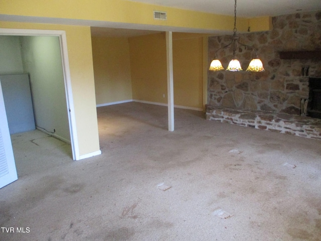 basement featuring light colored carpet and visible vents