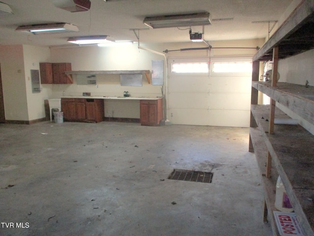 garage with a garage door opener and visible vents