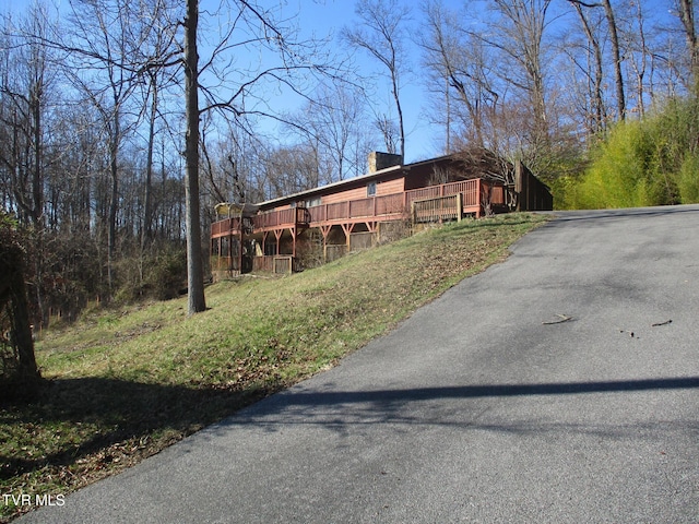 exterior space with a chimney and a deck