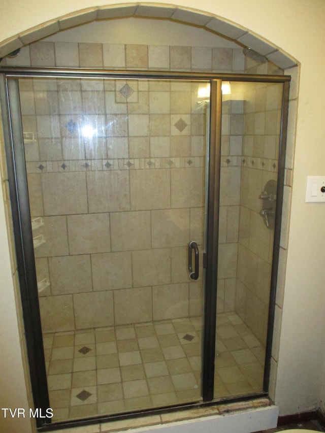 bathroom featuring a stall shower