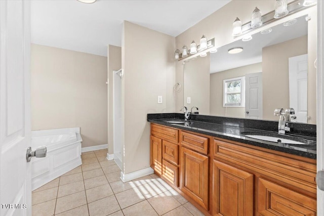 full bathroom featuring baseboards, a sink, a bath, and tile patterned floors