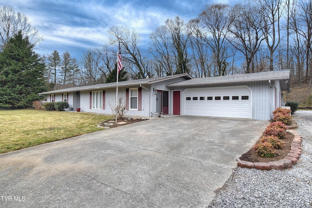 ranch-style house with a garage, driveway, and a front lawn