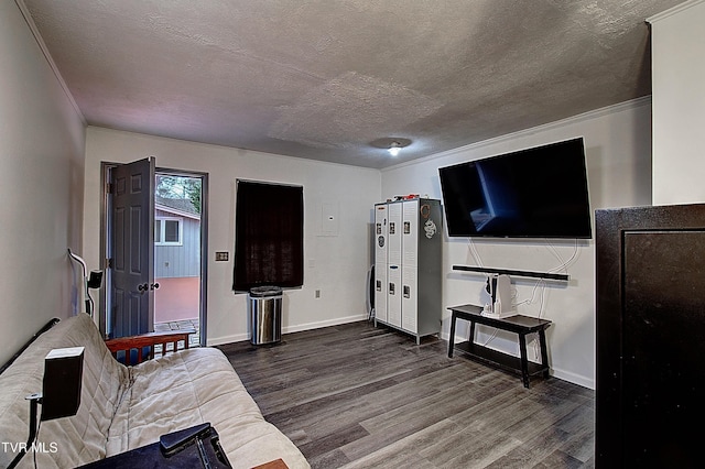 living room with baseboards, dark wood-type flooring, and a textured ceiling