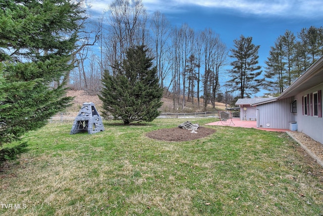 view of yard featuring a patio and fence