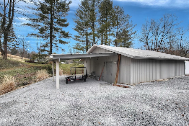 view of vehicle parking with a carport