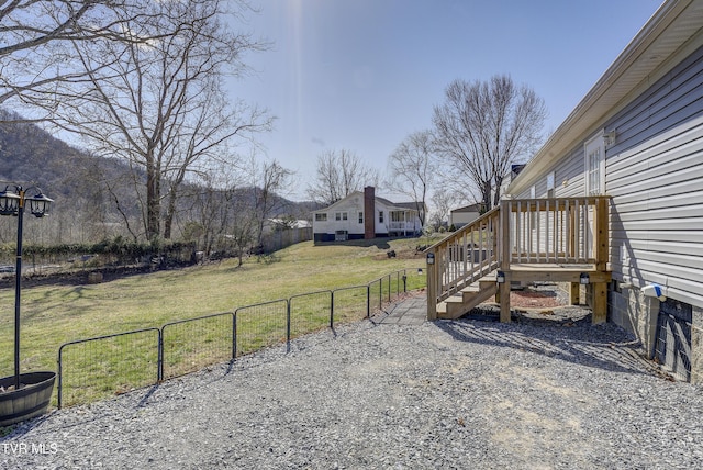 view of yard featuring a gate and fence