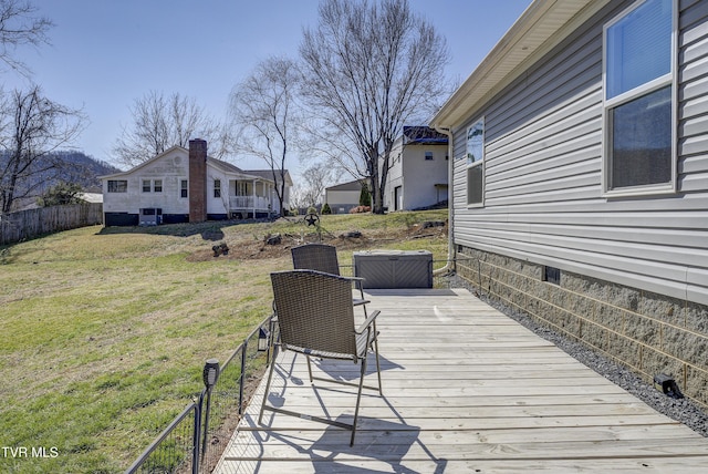 deck with fence and a yard