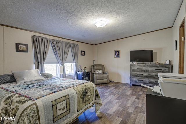 bedroom featuring a textured ceiling, vaulted ceiling, wood finished floors, and crown molding