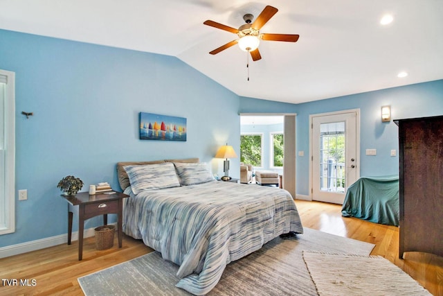 bedroom featuring lofted ceiling, a ceiling fan, baseboards, access to exterior, and light wood finished floors