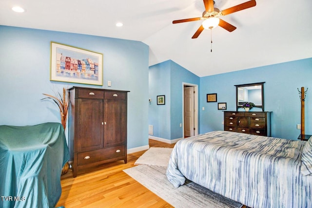 bedroom featuring recessed lighting, baseboards, vaulted ceiling, and light wood finished floors