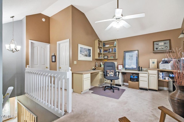 office with high vaulted ceiling, light colored carpet, ceiling fan with notable chandelier, baseboards, and built in study area