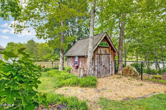 view of shed featuring a fenced backyard