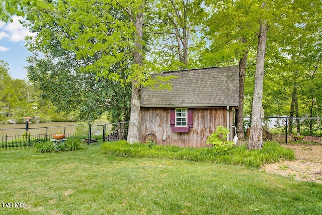 view of shed featuring fence