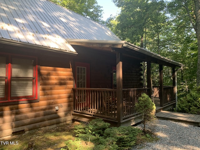 view of side of home with metal roof