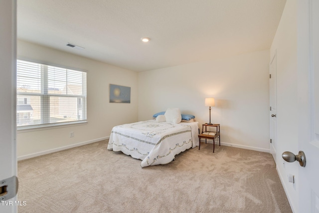 bedroom with light carpet, recessed lighting, visible vents, and baseboards