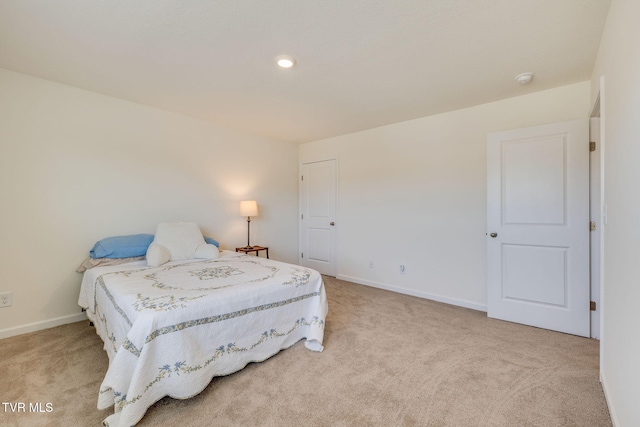 bedroom featuring light carpet, baseboards, and recessed lighting