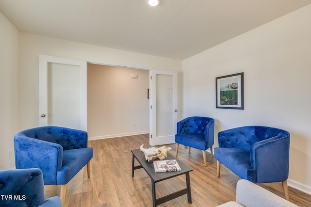 sitting room featuring wood finished floors and baseboards