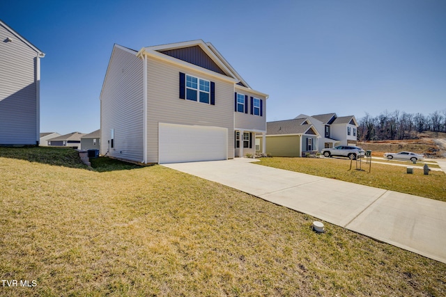 view of front of property with a garage, driveway, board and batten siding, and a front yard