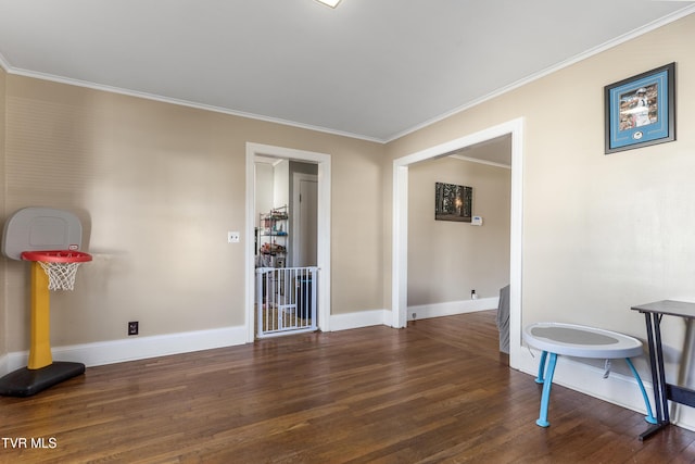 interior space featuring dark wood-style floors, baseboards, and crown molding