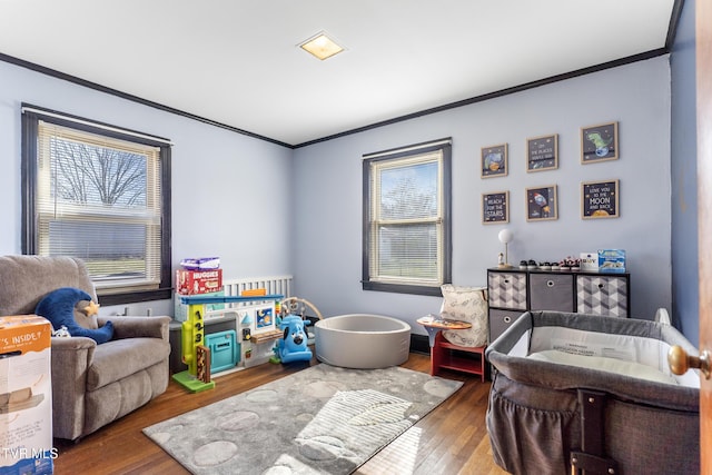 bedroom with dark wood-type flooring and crown molding