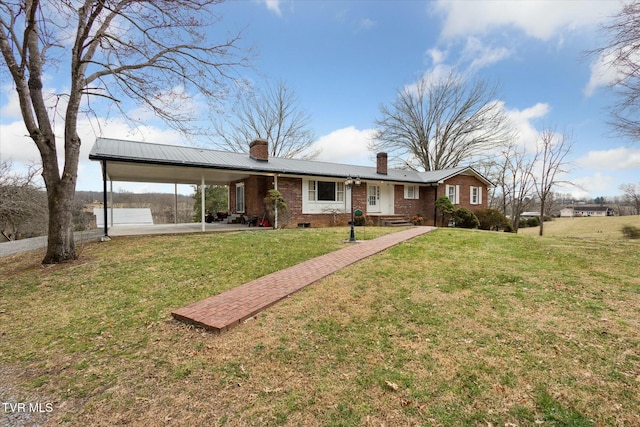 ranch-style home with metal roof, brick siding, a front lawn, and a chimney