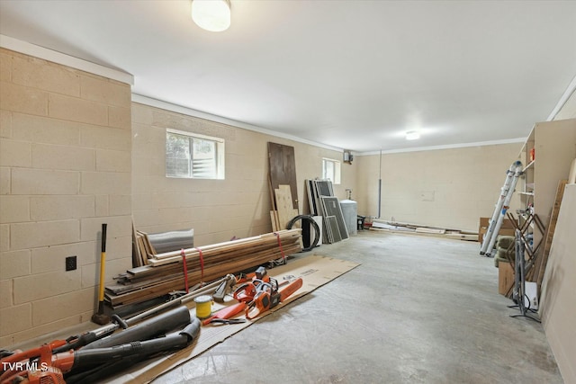 below grade area with concrete block wall and ornamental molding
