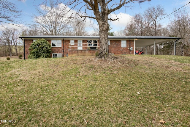 back of house featuring brick siding, central AC unit, and a yard