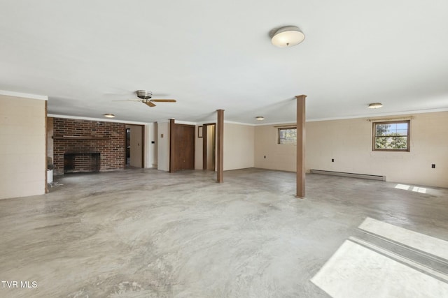 unfurnished living room featuring a brick fireplace, a healthy amount of sunlight, a ceiling fan, baseboard heating, and finished concrete flooring