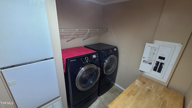 laundry room with laundry area, tile patterned flooring, and washer and dryer