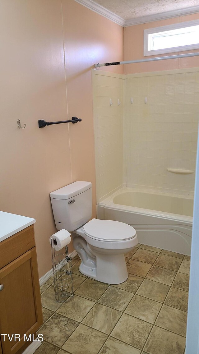 bathroom featuring crown molding, shower / bathing tub combination, toilet, a textured ceiling, and vanity