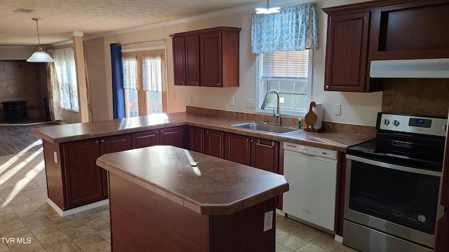 kitchen featuring a peninsula, exhaust hood, a sink, stainless steel range with electric cooktop, and dishwasher