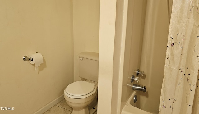 bathroom with shower / bath combo, tile patterned floors, toilet, and baseboards