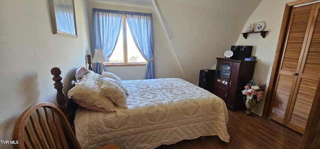 bedroom featuring dark wood-style flooring