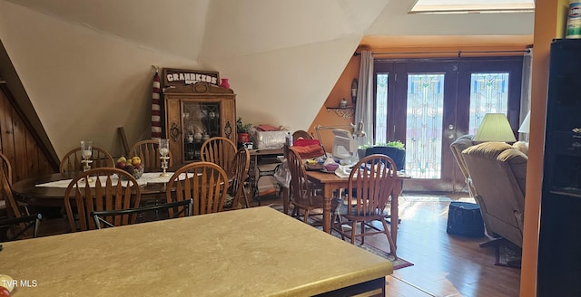 dining room with wood finished floors and french doors