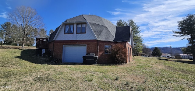 view of side of property with driveway, central air condition unit, a lawn, and brick siding